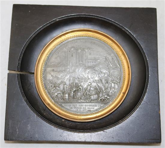 A late 18th century French lead medallion commemorating the Siege de la Bastille, overall 5.25 x 5.5in.
